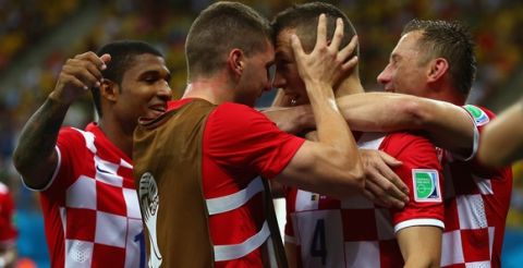 MANAUS, BRAZIL - JUNE 18:  Ivan Perisic of Croatia (2nd R) celebrates with teammates after scoring his team's second goal during the 2014 FIFA World Cup Brazil Group A match between Cameroon and Croatia at Arena Amazonia on June 18, 2014 in Manaus, Brazil.  (Photo by Clive Brunskill/Getty Images)