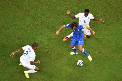 MANAUS, BRAZIL - JUNE 14:  Glen Johnson and Danny Welbeck of England close down Andrea Pirlo of Italy during the 2014 FIFA World Cup Brazil Group D match between England and Italy at Arena Amazonia on June 14, 2014 in Manaus, Brazil.  (Photo by Pool/Getty Images)