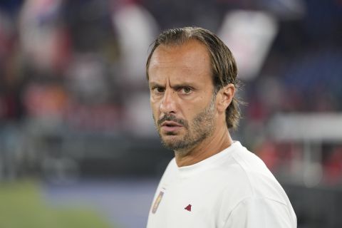 Genoa's head coach Alberto Gilardino looks on prior to the startof a Serie A soccer match between Lazio and Genoa, at Rome's Olympic Stadium, Sunday, Aug. 27, 2023. (AP Photo/Andrew Medichini)