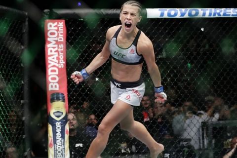 Poland's Joanna Jedrzejczyk runs around the octagon before a women's strawweight title bout against Rose Namajunas at UFC 223 Saturday, April 7, 2018, in New York. Namajunas won the fight. (AP Photo/Frank Franklin II)