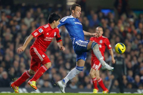 Chelsea's Captain John Terry (R) vies with Liverpool's Uruguan player Luis Suarez during an English Premier League football match between Chelsea and Liverpool at Stamford Bridge in London on November 20, 2011. AFP PHOTO/IAN KINGTON

RESTRICTED TO EDITORIAL USE. No use with unauthorised audio, video, data, fixture lists, club/league logos or âliveâ services. Online in-match use limited to 45 images, no video emulation. No use in betting, games or single club/league/player publications. (Photo credit should read IAN KINGTON/AFP/Getty Images)