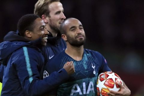 Tottenham's Lucas Moura carries the ball away at the end of the Champions League semifinal second leg soccer match between Ajax and Tottenham Hotspur at the Johan Cruyff ArenA in Amsterdam, Netherlands, Wednesday, May 8, 2019. Moura scored a hat trick. (AP Photo/Peter Dejong)