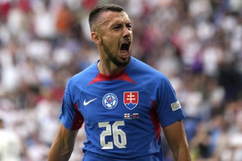 Slovakia's Ivan Schranz celebrates after scoring his side's opening goal during a round of sixteen match between England and Slovakia at the Euro 2024 soccer tournament in Gelsenkirchen, Germany, Sunday, June 30, 2024. (AP Photo/Ariel Schalit)