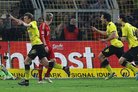 DORTMUND, GERMANY - APRIL 11: Kevin Grosskreutz (C) of Dortmund celebrates his team's 1st goal during the Bundesliga match between Borussia Dortmund and FC Bayern Muenchen at Signal Iduna Park on April 11, 2012 in Dortmund, Germany.  (Photo by Martin Rose/Bongarts/Getty Images)