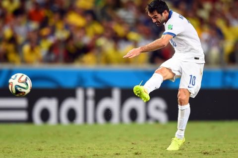 FORTALEZA, BRAZIL - JUNE 24: Giorgos Karagounis of Greece shoots during the 2014 FIFA World Cup Brazil Group C match between Greece and the Ivory Coast at Castelao on June 24, 2014 in Fortaleza, Brazil.  (Photo by Laurence Griffiths/Getty Images)