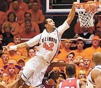 Herald & Review / Kelly J. Huff<br>
Forward Brian Randle soars for a dunk against Indiana on Sunday. The Illini won, 70-58.