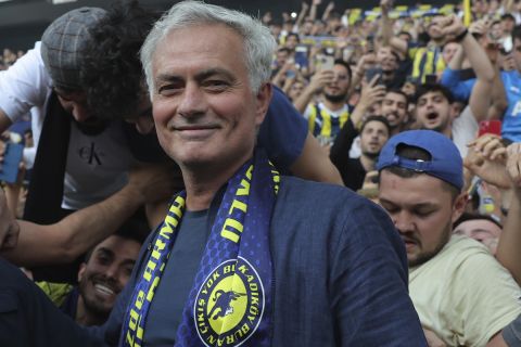 Portuguese soccer coach Jose Mourinho poses for the media with supporters during his official presentation as Turkish's Fenerbahce new coach at Sukru Saracoglu stadium in Istanbul, Turkey, Sunday, June 2, 2024. Mourinho has signed a two-year contract with Fenerbahce. (AP Photo)