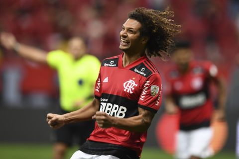 Willian Arao of Brazil's Flamengo celebrates scoring his side's third goal against Paraguay's Olimpia during a Copa Libertadores soccer match at National Stadium in Brasilia, Brazil, Wednesday, Aug.18, 2021. (Evaristo Sa/Pool via AP)