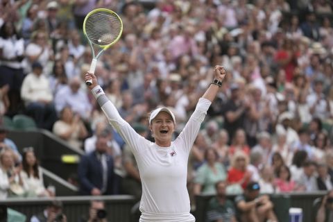 Barbora Krejcikova of the Czech Republic celebrates after defeating Elena Rybakina of Kazakhstan in their semifinal match at the Wimbledon tennis championships in London, Thursday, July 11, 2024. (AP Photo/Mosa'ab Elshamy)