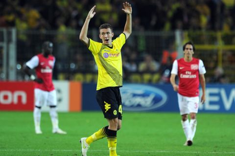 Dortmund's Croatian midfielder Ivan Perisic celebrates scoring during the UEFA Champions League Group F first-leg match Dortmund vs Arsenal London on September 13, 2011 in the western German city of Dortmund. The match ended with a 1-1 draw. AFP PHOTO / PATRIK STOLLARZ (Photo credit should read PATRIK STOLLARZ/AFP/Getty Images)