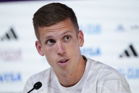 Spain's Dani Olmo speaks to reporters during a news conference, in Doha, Qatar, Saturday, Nov. 26, 2022. Spain will play its second match in Group E in the World Cup soccer tournament against Germany on Nov. 27. (AP Photo/Julio Cortez)