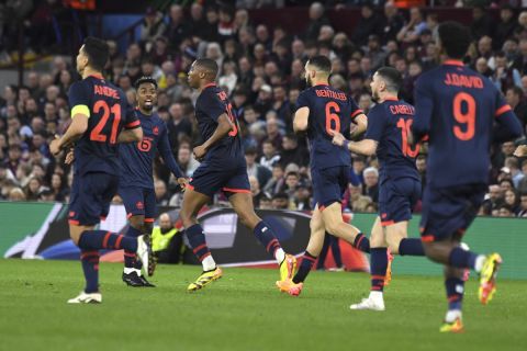 Lille's Bafode Diakite, second left, celebrates after scoring his side's opening goal during the Europa Conference League quarter final first leg soccer match between Aston Villa and Lille at Villa Park in Birmingham, England, Thursday, April 11, 2024. (AP Photo/Rui Vieira)