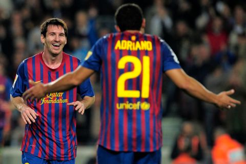 FC Barcelona's Argentinian forward Lionel Messi (L) celebrates his goal during the Spanish league football match FC Barcelona vs Mallorca on October 29, 2011 at the Camp Nou stadium in Barcelona.   AFP PHOTO/ JOSEP LAGO (Photo credit should read JOSEP LAGO/AFP/Getty Images)