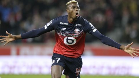 Lille's Victor Osimhen reacts after scoring during his French League One soccer match between Lille and Brest at the Lille Metropole stadium, in Villeneuve d'Ascq, northern France, Friday, Dec. 6, 2019. (AP Photo/Michel Spingler)