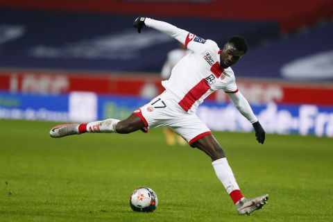 Dijon's Mama Balde runs with the ball during the French League One soccer match between Lille and Dijon at the Stade Pierre Mauroy stadium in Villeneuve d'Ascq, northern France, Sunday, Jan. 31, 2021. (AP Photo/Michel Spingler)