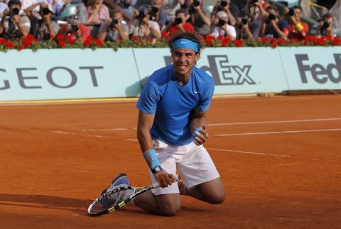 Spain's Rafael Nadal reacts after winning over Switzerland's Roger Federer during their men's final in the French Open tennis championship at the Roland Garros stadium, on June 5, 2011, in Paris.  AFP PHOTO / PATRICK KOVARIK (Photo credit should read PATRICK KOVARIK/AFP/Getty Images)