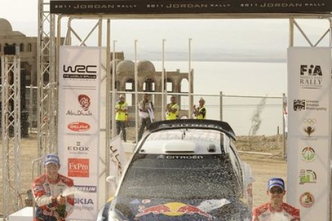 AMMAN, JORDAN - APRIL 16:  Sebastien Ogier and Julien Ingrassia of France celebrate their victory during Day 2 of the WRC Rally Jordan on April 16, 2011 in Amman, Jordan.  (Photo by Massimo Bettiol/Getty Images)