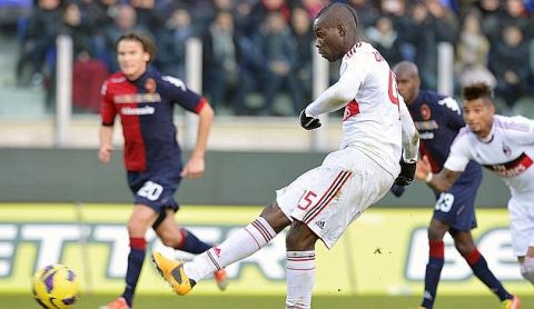 AC Milan's forward Mario Balotelli kicks the ball during the Serie A football match against Cagliari at the Cagliari's Is Arenas stadium on February 10, 2013 . AFP PHOTO / ALBERTO LINGRIA
