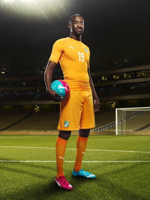 Yaya Touré in the 2014 Ivory Coast Home Kit that features PUMA's PWR ACTV Technology 