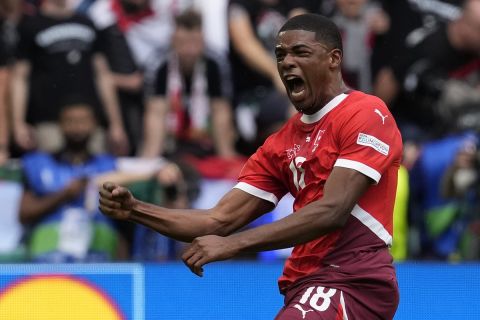 Switzerland's Kwadwo Duah celebrates after scoring his side's opening goal during a Group A match between Hungary and Switzerland at the Euro 2024 soccer tournament in Cologne, Germany, Saturday, June 15, 2024. (AP Photo/Darko Vojinovic)