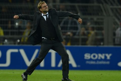 Dortmund's head coach Juergen Klopp celebrates during the UEFA Champions League group D first-leg football match Borussia Dortmund vs Ajax Amsterdam in the western German city of Dortmund on September 18, 2012.  AFP PHOTO / PATRIK STOLLARZ        (Photo credit should read PATRIK STOLLARZ/AFP/GettyImages)