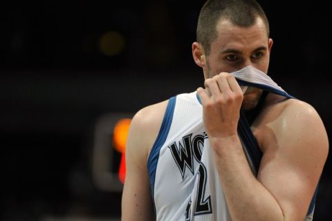 MINNEAPOLIS, MN - APRIL 1: Kevin Love #42 of the Minnesota Timberwolves reacts to a foul during the second half of a basketball game against the Miami Heat at Target Center on April 1, 2011 in Minneapolis, Minnesota. Heat defeated the Timberwolves 111- 92. NOTE TO USER: User expressly acknowledges and agrees that, by downloading and or using this Photograph, user is consenting to the terms and conditions of the Getty Images License Agreement.  (Photo by Hannah Foslien /Getty Images)