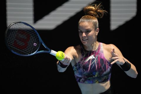 Maria Sakkari of Greece plays a forehand return to Yuan Yue of China during their first round match at the Australian Open tennis championship in Melbourne, Australia, Monday, Jan. 16, 2023. (AP Photo/Aaron Favila)