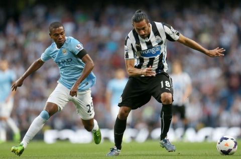 Football - Manchester City v Newcastle United - Barclays Premier League - Etihad Stadium - 13/14 - 19/8/13
Manchester City's Fernandinho (L) and Newcastle United's Jonas Gutierrez in action
Mandatory Credit: Action Images / Carl Recine

EDITORIAL USE ONLY. No use with unauthorized audio, video, data, fixture lists, club/league logos or live services. Online in-match use limited to 45 images, no video emulation. No use in betting, games or single club/league/player publications.  Please contact your account representative for further details.