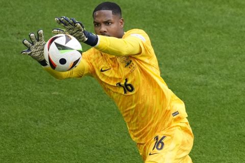 France goalkeeper Mike Maignan catches the ball during a round of sixteen match between France and Belgium at the Euro 2024 soccer tournament in Duesseldorf, Germany, Monday, July 1, 2024. (AP Photo/Andreea Alexandru)