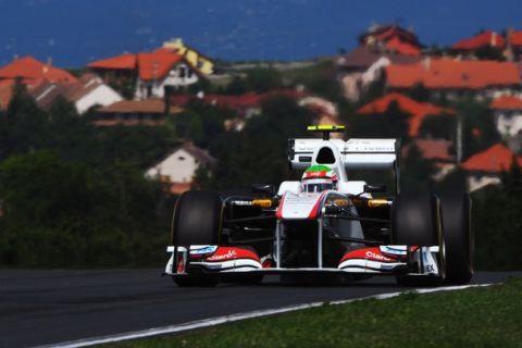 BUDAPEST, HUNGARY - JULY 30:  Sergio Perez of Mexico and Sauber F1 drives during qualifying for the Hungarian Formula One Grand Prix at the Hungaroring on July 30, 2011 in Budapest, Hungary.  (Photo by Lars Baron/Getty Images)