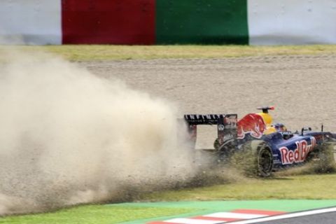 Red Bull-Renault driver Sebastian Vettel of Germany drives over gravel during the first practice session of Formula One's Japanese Grand Prix at Suzuka, western Japan on October 7, 2011.    AFP PHOTO / TOSHIFUMI KITAMURA (Photo credit should read TOSHIFUMI KITAMURA/AFP/Getty Images)