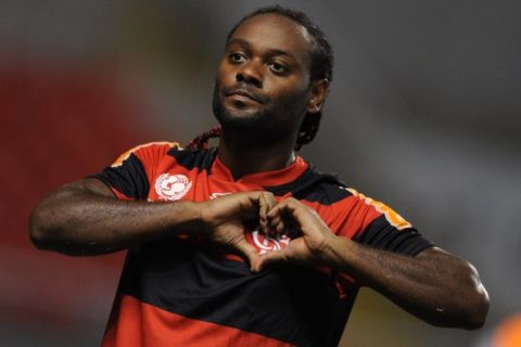 Flamengo's Wagner Love makes a heart celebrating a goal against Emelec during their Libertador Cup match on March 8, 2012 at the Olympic stadium in Rio de Janeiro, Brazil.   AFP PHOTO  ANTONIO SCORZA (Photo credit should read ANTONIO SCORZA/AFP/Getty Images)