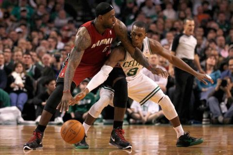 BOSTON - FEBRUARY 13:  LeBron James #6 of the Miami Heat battles Rajon Rondo #9 of the Boston Celtics for control of the ball at TD Garden on February 13, 2011 in Boston, Massachusetts. NOTE TO USER: User expressly acknowledges and agrees that, by downloading and/or using this Photograph, user is consenting to the terms and conditions of the Getty Images License Agreement. (Photo by Jim Rogash/ Getty Images)