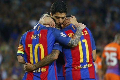 Barcelona's Lionel Messi, Barcelona's Luis Suarez and Barcelona's Neymar, from left to right, celebrate their fourth goal during a Champions League, Group C soccer match between Barcelona and Manchester City, at the Camp Nou stadium in Barcelona, Wednesday, Oct. 19, 2016. (AP Photo/Francisco Seco)