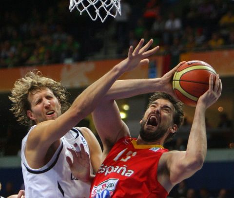 Germany's Dirk Nowitzki (L) vies with Spain's Marc Gasol (R) during their Euro Basket 2011 group E second round qualification match between Spain and Germany in Vilnius on September 7, 2011.     AFP PHOTO/ PETRAS MALUKAS (Photo credit should read PETRAS MALUKAS/AFP/Getty Images)