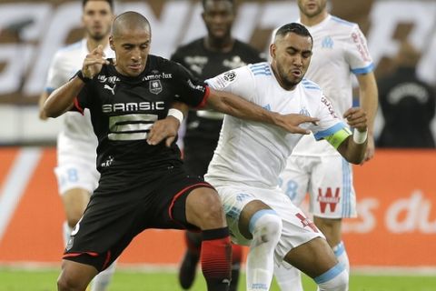 Marseille's Dimitri Payet, right, challenges for the ball with Rennes' Wahbi Khazri during the League One soccer match between Marseille and Rennes, at the Velodrome stadium, in Marseille, southern France, Sunday, Sept. 10, 2017. (AP Photo/Claude Paris)