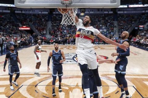 New Orleans Pelicans forward Anthony Davis (23) slam-dunks in the first half of an NBA basketball game against the Memphis Grizzlies in New Orleans, Monday, Jan. 7, 2019. (AP Photo/Gerald Herbert)