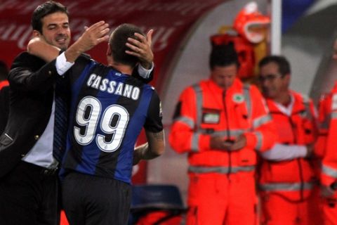 Inter Milan forward Antonio Cassano, back to camera, embraces his coach Andrea Stramaccioni after scoring during a Serie A soccer match against Chievo at Bentegodi stadium in Verona, Italy, Wednesday, Sept. 26, 2012. (AP Photo/Felice Calabro')