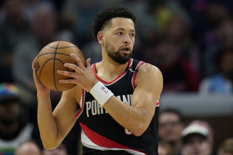 Portland Trail Blazers guard Skylar Mays handles the ball during the first half of an NBA basketball game against the Minnesota Timberwolves, Sunday, April 2, 2023, in Minneapolis. (AP Photo/Abbie Parr)