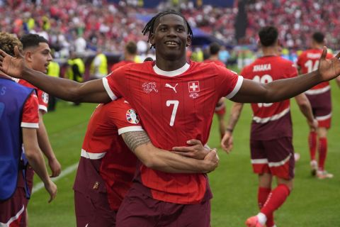 Switzerland's Breel Embolo celebrates after scoring his side's third goal during a Group A match between Hungary and Switzerland at the Euro 2024 soccer tournament in Cologne, Germany, Saturday, June 15, 2024. (AP Photo/Darko Vojinovic)