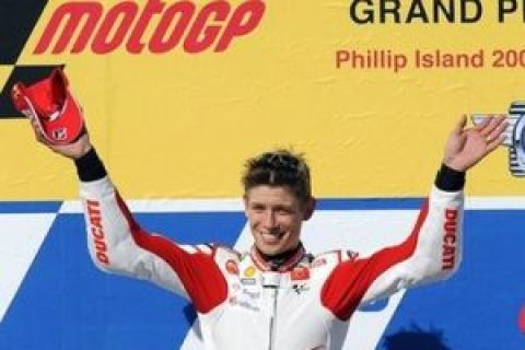 MotoGP rider Casey Stoner of Australia celebrates after winning the Australian Grand Prix motorcycle racing on Phillip Island, Australia,  Sunday, Oct. 18, 2009. Valentino Rossi of Italy came second with Dani Pedrosa of Spain third. (AP Photo/Andrew Brownbill)