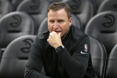 Portland Trail Blazers assistant coach Scott Brooks on the court before an NBA basketball game against the Atlanta Hawks, Monday, March 14, 2022, in Atlanta. (AP Photo/Brett Davis)