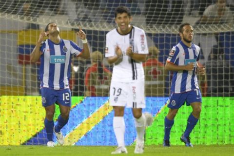 FC Porto's forward from Brazil Givanildo de Souza "Hulk" (L) celebrates close teammate argentinian forward Fernando Belluschi (R) after scoring against Vitoria SC during their Portuguese league football match at the Afonso Henriques Stadium in Guimaraes, northern Portugal, on October 4, 2010. AFP PHOTO/MIGUEL RIOPA (Photo credit should read MIGUEL RIOPA/AFP/Getty Images)