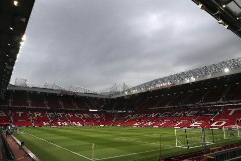 The lights are turned on in the stadium before the English Premier League soccer match between Manchester United and Manchester City at Old Trafford Stadium in Manchester, England, Wednesday April 24, 2019. (AP Photo/Jon Super)