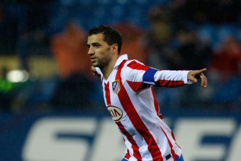 Atletico de Madrid's Simao Sabrosa from Portugal celebrates after scoring a penalty against Espanyol during his Spanish Copa del Rey soccer match at the Vicente Calderon stadium in Madrid, Wednesday, Dec. 22, 2010. (AP Photo/Arturo Rodriguez)