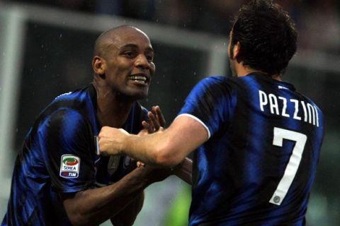 Inter Milan's Gianpaolo Pazzini (R) celebrates with his teammate Douglas Maicon after scoring a second goal against Cesena during their Italian Serie A soccer match at the Manuzzi stadium in Cesena April 30, 2011.  REUTERS/Alessandro Garofalo (ITALY - Tags: SPORT SOCCER)