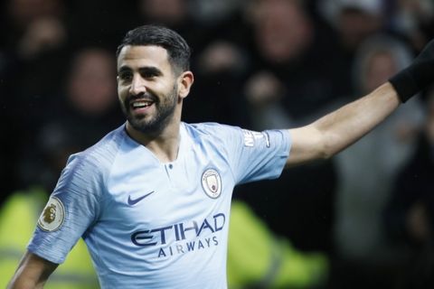 Manchester City's Riyad Mahrez celebrates after scoring his side's second goal during the English Premier League soccer match between Watford and Manchester City at Vicarage Road stadium in Watford, England, Tuesday, Dec. 4, 2018. (AP Photo/Frank Augstein)