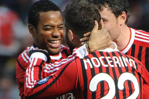 AC Milan's defender Antonio Nocerino (R) is congratulated by AC Milan's Brazilian forward Robinho after scoring during the seria A match Milan against Lecce on March 11, 2012, in San Siro stadium in Milan. AFP PHOTO / OLIVIER MORIN (Photo credit should read OLIVIER MORIN/AFP/Getty Images)