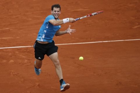 Austria's Dominic Thiem plays a shot against Spain's Rafael Nadal during the men's final match of the French Open tennis tournament at the Roland Garros stadium in Paris, Sunday, June 9, 2019. (AP Photo/Christophe Ena)