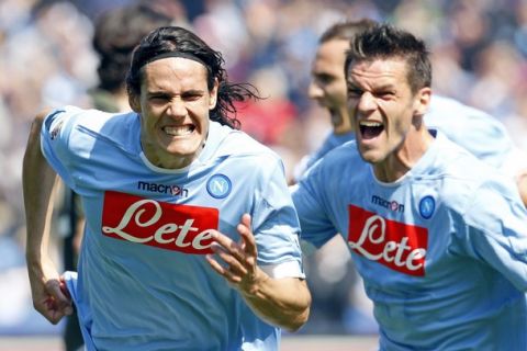 Napoli's Edinson Cavani (L) celebrates with his team mate Christian Maggio after scoring against Lazio during their Italian Serie A soccer match at the San Paolo stadium in Naples April 3, 2011. REUTERS/Giampiero Sposito (ITALY - Tags: SPORT SOCCER)